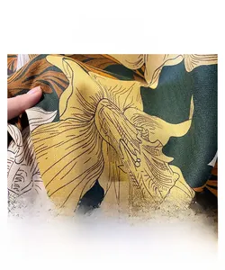 Detail of fine overlock stitching on floral printed silk scarf with twill texture