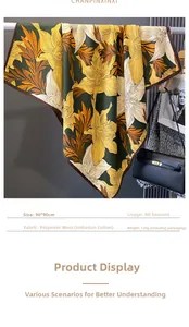 Detailed view of 90cm square scarf featuring orange lilies on a dark green background