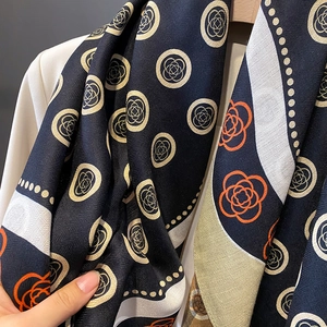 Navy and orange polka dot printed scarf with elegant geometric floral texture