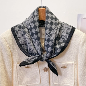 Elegant black and white checkerboard silk scarf styled with a luxury tweed jacket