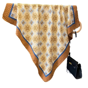 Vintage patterned silk scarf with golden geometric motifs and blue accents for women