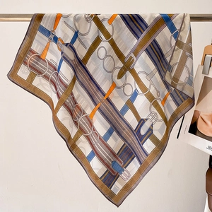 Contrast color silk square scarf with classic belt and equestrian print hanging naturally