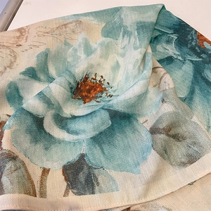 Elegant cotton-linen scarf with cyan floral print and textured herringbone weave detail