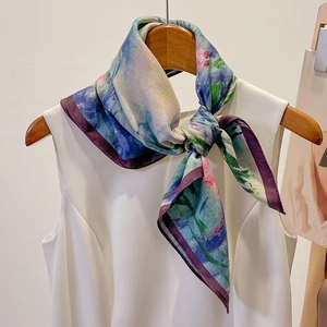 Elegant oil painting style square scarf in indigo and violet, draped on a white top
