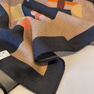 Modern geometric square silk scarf with herringbone pattern in orange and black