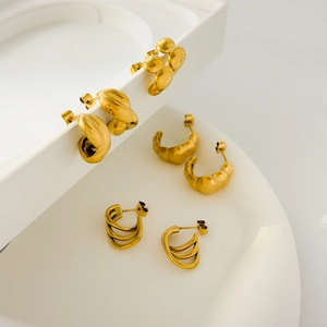 Set of four 18K gold plated stainless steel croissant and multi-layer stud earrings