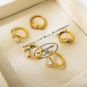 Close-up of 5-piece 18K gold plated ring set with multi-shape zircon in jewelry box