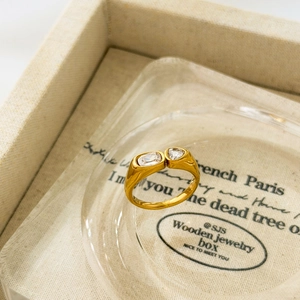 Macro view of 18K gold plated ring with marquise and heart-shaped cubic zirconia