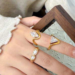 Set of three 18K gold plated titanium rings with marquise and triangle cubic zirconia