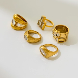 Collection of 18K gold-plated titanium steel rings featuring zircon insets and diverse designs