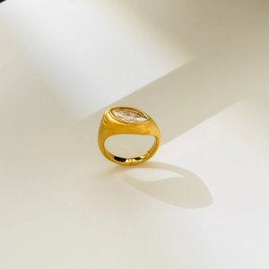 Macro detail of marquise-cut zircon ring in 18K gold plated stainless steel band