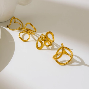 Polished 18K gold-plated titanium rings with abstract hollow heart and curved line designs