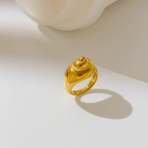 Detailed macro view of 18K gold plated conch shell ring with high polish finish