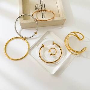 Three-tone titanium steel screw bangles and twisted open rings in gold, silver, and rose gold