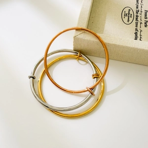 Three-tone adjustable stainless steel bangles in gold, silver, and rose gold finishes