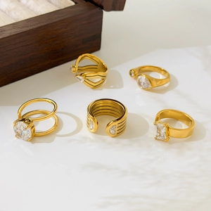 Macro shot of 18K gold plated titanium rings set with clear emerald-cut cubic zirconia