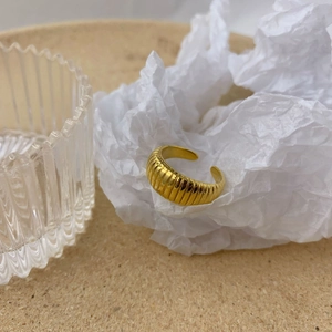 Minimalist golden olive leaf croissant open ring with textured ripple design