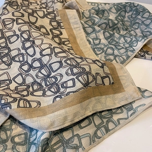 Elegant geometric D-ring pattern scarf in beige and brown with soft twill texture