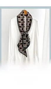 Detail of checkered neck scarf tied on a white shirt showing retro drape and texture