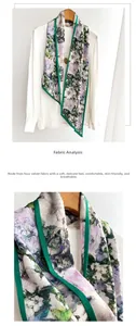 Detail of floral printed scarf with green edges showing soft fabric texture on a shirt