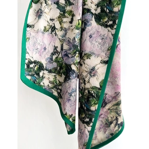 Floral print neck scarf with lavender peonies and green herringbone border detail