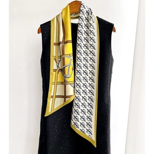 Fashionable horse bit print neck scarf in yellow and beige on black dress