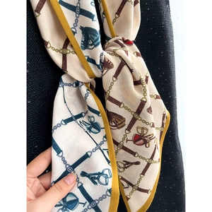 Elegant equestrian pattern silk scarf with mustard yellow border and horse chain print