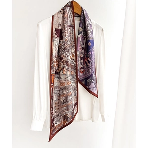 Elegant vintage silk scarf with European city prints tied on white shirt collar