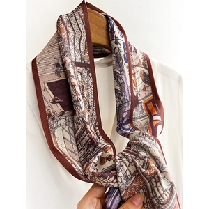 Vintage architectural print silk scarf styled on a wooden hanger with white shirt