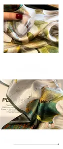 Detail of silk scarf with floral print showing fine stitching and smooth fabric texture