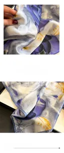 Detailed view of purple floral silk scarf featuring smooth satin texture and fine stitching