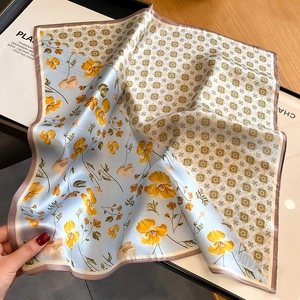 Elegant square silk scarf with light blue floral and yellow geometric patterns for women