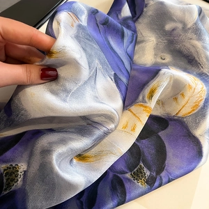 Elegant purple and yellow floral silk square scarf with lightweight glossy texture