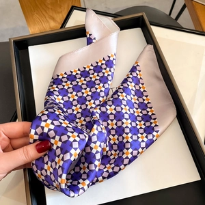 Silk square scarf with purple and orange geometric patterns and a satin finish
