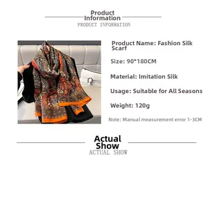 Detail showing 90x180cm faux silk scarf with orange paisley pattern and 120g weight