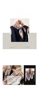 Detail of bohemian feather print cotton linen scarf with elegant ethnic patterns