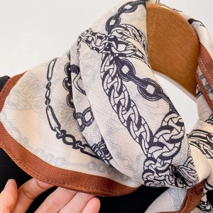 Retro chain print silk scarf with cream and blue patterns on premium linen-feel fabric