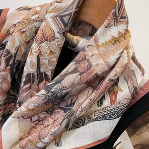 Retro print silk square scarf in warm beige and ochre with bohemian feather patterns