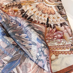 Elegant printed silk square scarf with feather patterns and fine twill weaving detail