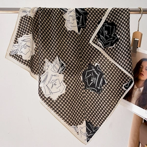 Detail of satin square scarf featuring houndstooth pattern and rose floral print