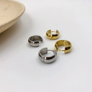 Polished gold and silver stainless steel hoop earrings in minimalist geometric style