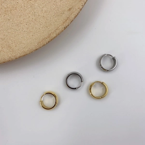 Minimalist geometric titanium steel huggie earrings in gold, silver, and gunmetal finishes