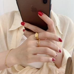Minimalist gold geometric signet rings set with thin bracelet for women in casual style