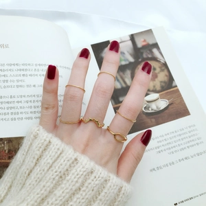 Set of six minimalist gold thin rings for women featuring plain bands and wave designs