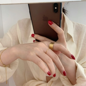 Minimalist 18K gold plated titanium ring set with textured wide band and slim bracelet