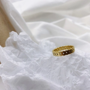 Irregular wide gold butterfly chain ring with hollow design on white silk and paper