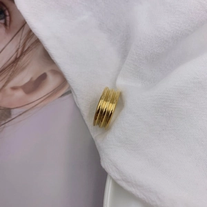 Minimalist multi-layered gold titanium steel ring with elegant grooved texture design