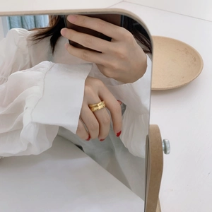 Irregular chunky gold double layer open ring with polished finish on finger