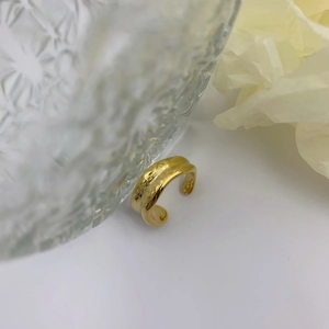 Minimalist irregular hammered gold open ring featuring a unique textured finish