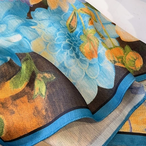 Floral cotton linen feel square scarf with blue and orange herringbone texture